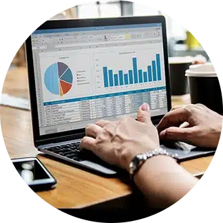 Laptop with man typing and showing SAP cloud analytics dashboard